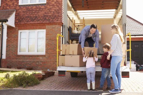 Careful loading of boxes and furniture during a house move in Uxbridge
