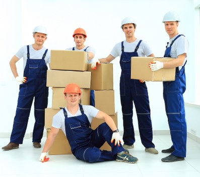 Packed office boxes and desks ready for transport in a local business move