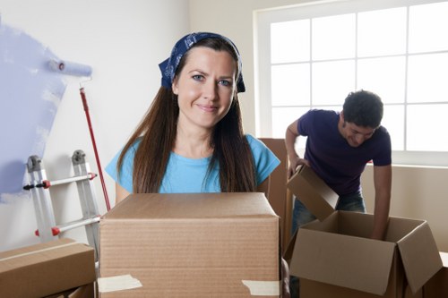 Helper carrying items for a residential move in Uxbridge