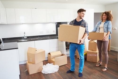 Local office relocation team handling furniture and boxes in Uxbridge