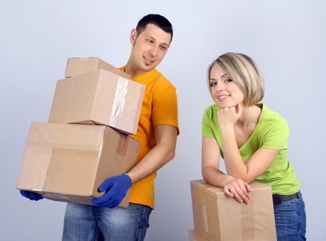 Removal van and movers working in a Uxbridge residential street