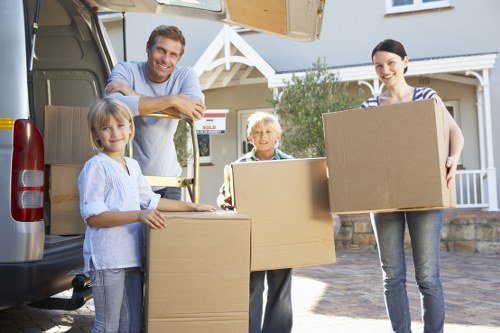Local removals team handling boxes and furniture in Uxbridge