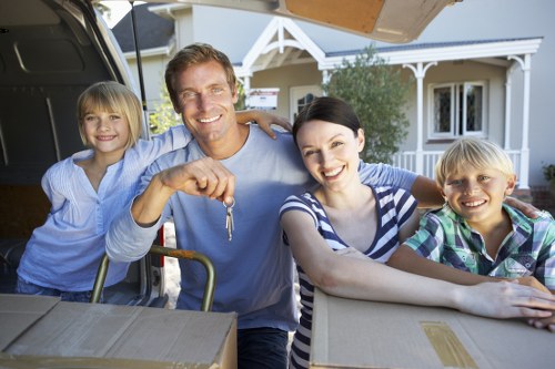 Professional movers navigating stairs and access in an Uxbridge property
