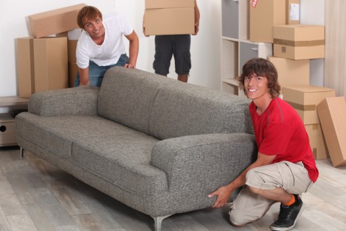 Local removals team handling boxes and furniture in Uxbridge