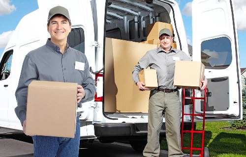 Family packing moving boxes in a Uxbridge home before moving day