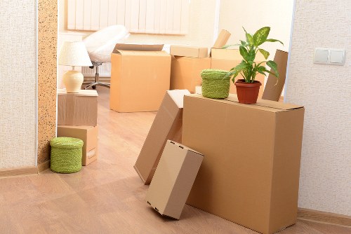 Local removals team handling boxes and furniture near Uxbridge
